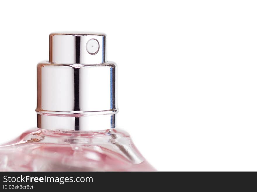 Sprayer of transparent perfume bottle isolated on while background. Macro view. Sprayer of transparent perfume bottle isolated on while background. Macro view.