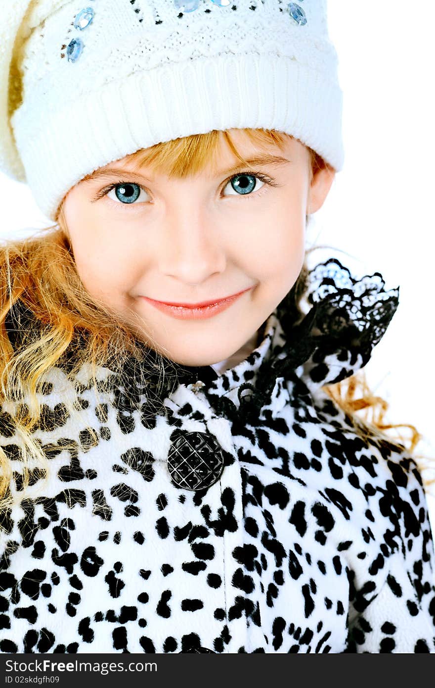 Portrait of a cute girl in a coat and cap. Isolated over white background. Portrait of a cute girl in a coat and cap. Isolated over white background.