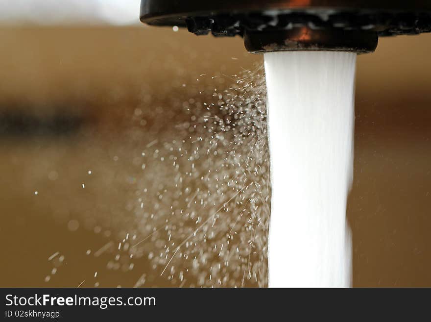 Water flowing out of the kitchen faucet