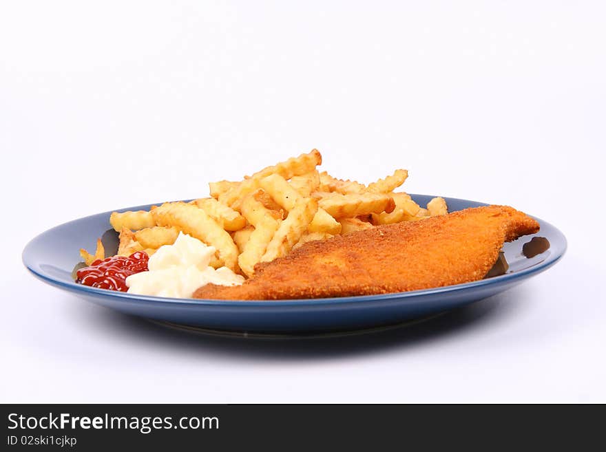 British cuisine: Fish and chips with ketchup and mayonnaise