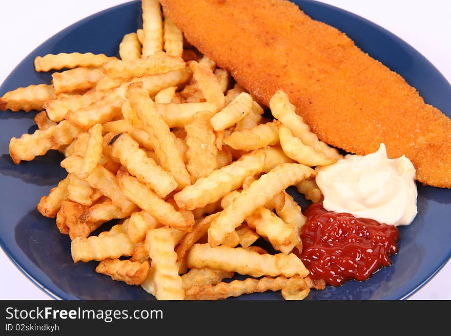 British cuisine: Fish and chips with ketchup and mayonnaise