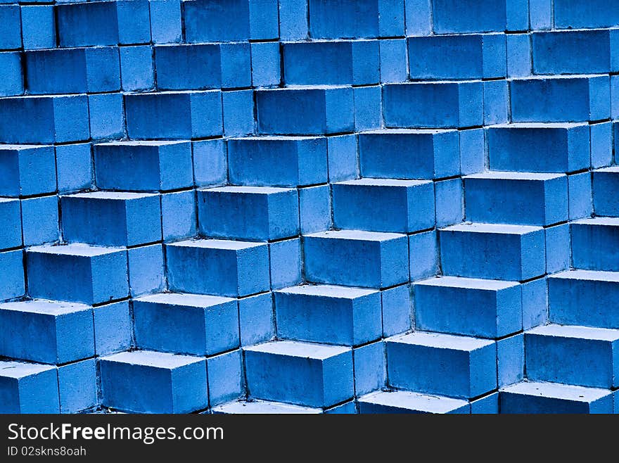 Blue brick background pattern with bricks