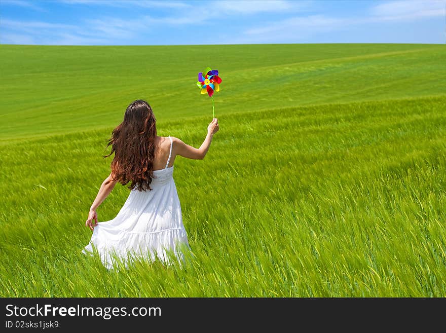 Girl in a green field, enjoying nature. Girl in a green field, enjoying nature