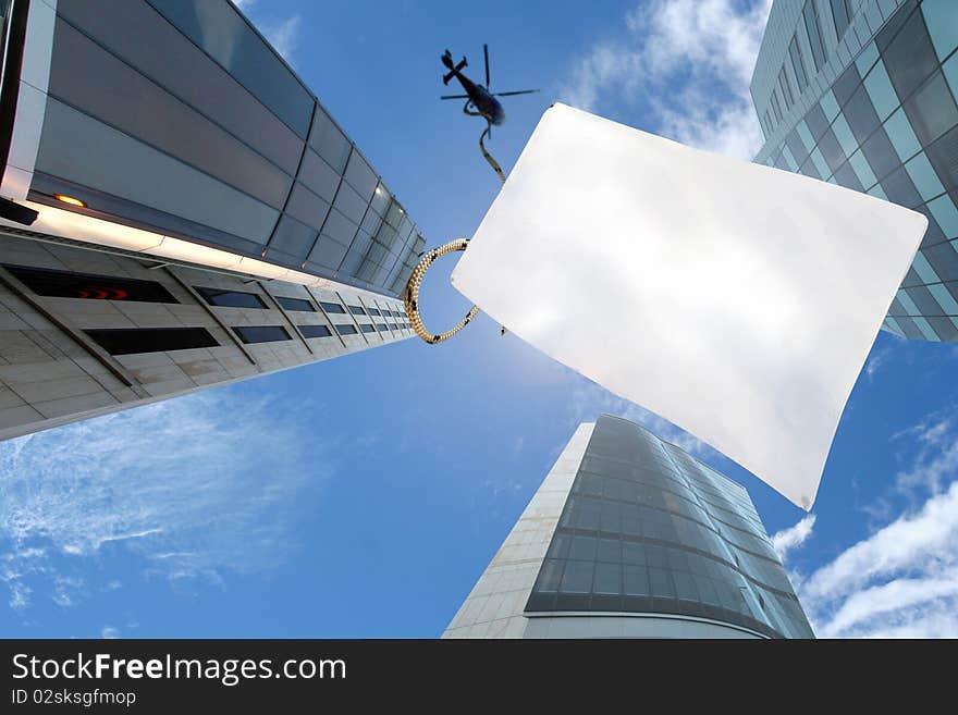 A Picture Of Blu Sky Over Skyscrapers And Chopper