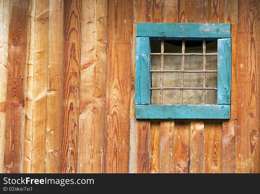 Closed window on an old wooden wall. Closed window on an old wooden wall