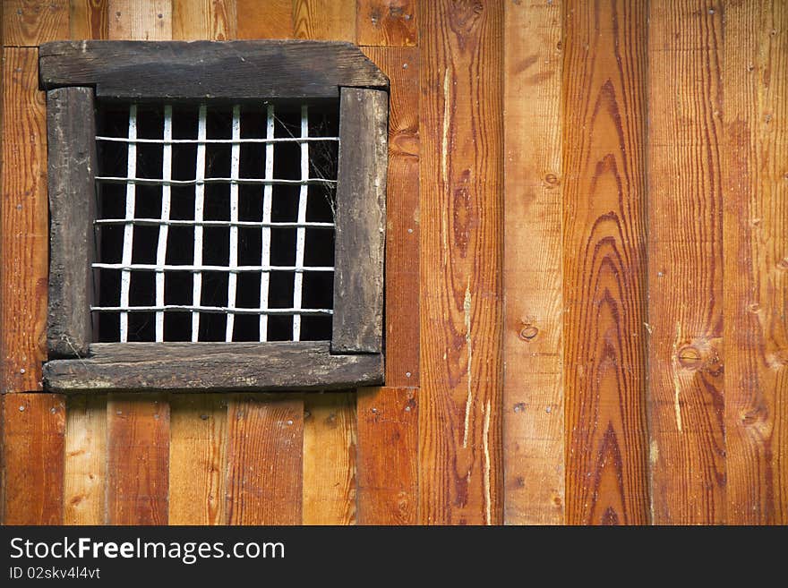 Closed window on an old wooden wall. Closed window on an old wooden wall