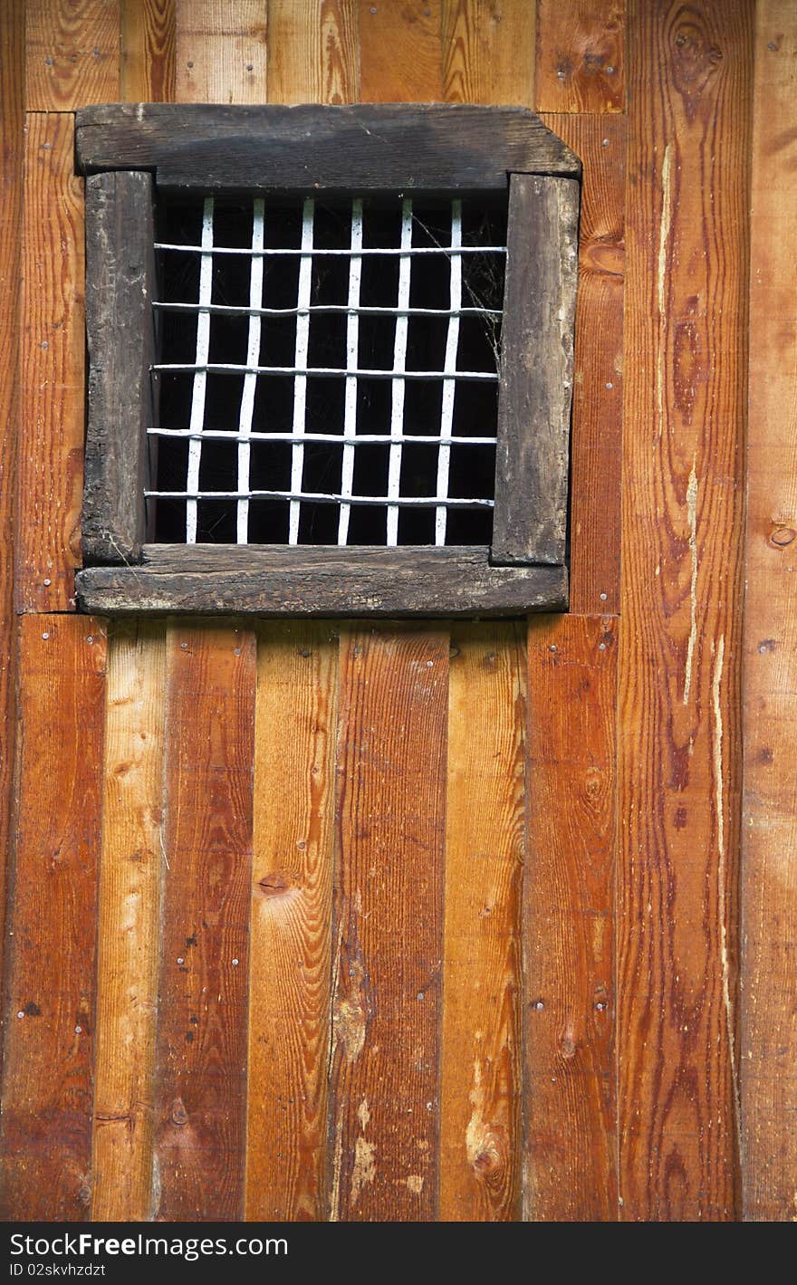 Closed window on an old wooden wall. Closed window on an old wooden wall