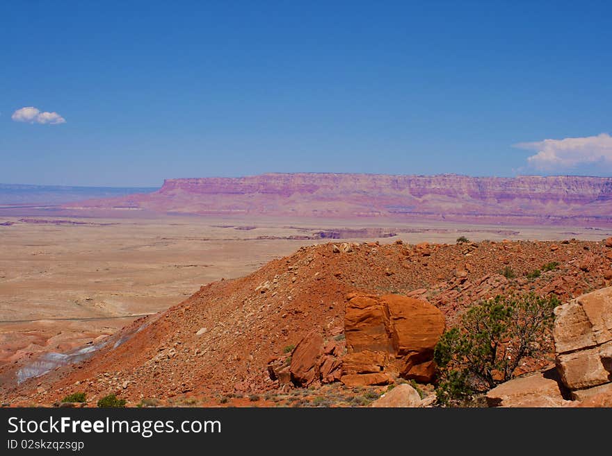 A mesa in the distance across the desert.