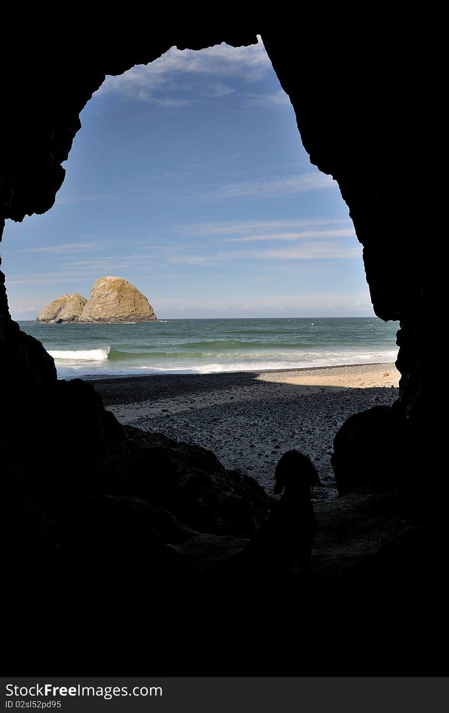 Oregon Coast Rocks seen from Cave with dog. Oregon Coast Rocks seen from Cave with dog