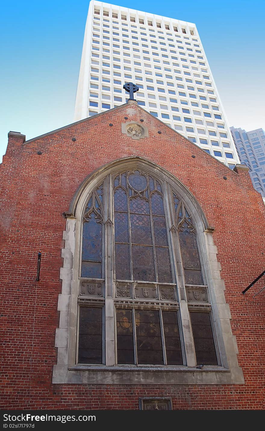 Old brick church with big vitraze window from San Francisco with new bouldings from downtown. Old brick church with big vitraze window from San Francisco with new bouldings from downtown.