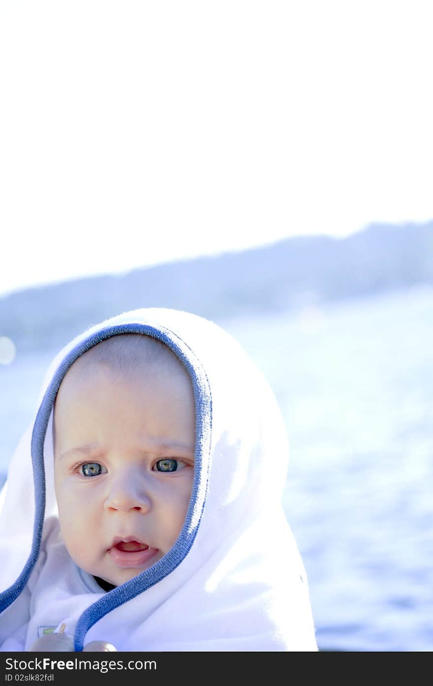 Portrait of the child in a blanket. Portrait of the child in a blanket