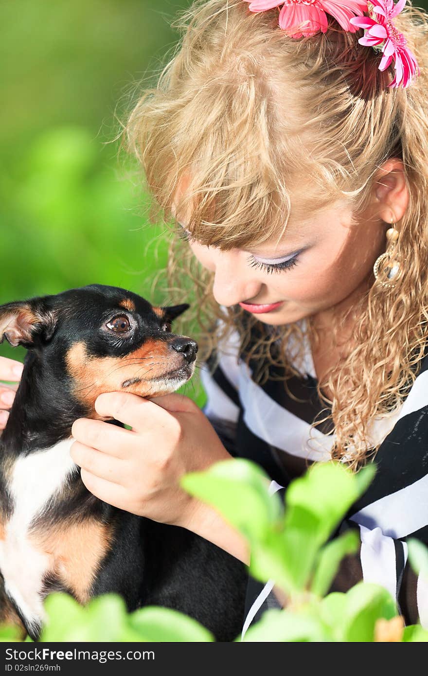 Beautiful young woman with her pet dog outdoor. Beautiful young woman with her pet dog outdoor