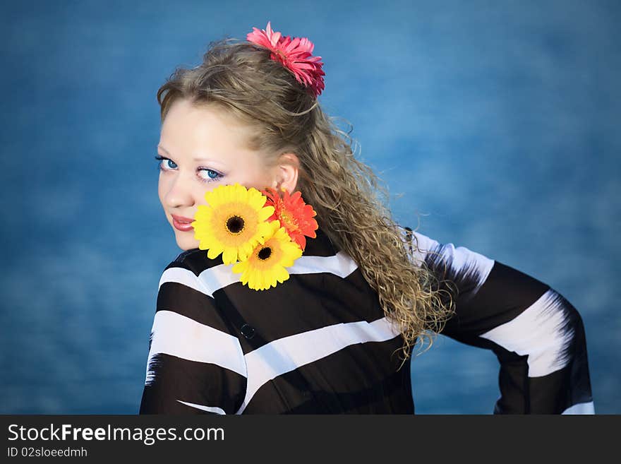 Beautiful woman with flowers in the sea. Beautiful woman with flowers in the sea