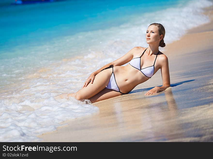 Beautiful Model Relaxing On A Beach