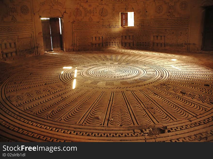 View inside an old Fula chiefs meeting house with carved floor and walls in Dalaba, Guinea. View inside an old Fula chiefs meeting house with carved floor and walls in Dalaba, Guinea