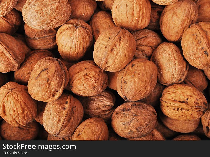 Textured background of walnuts close-up. Textured background of walnuts close-up