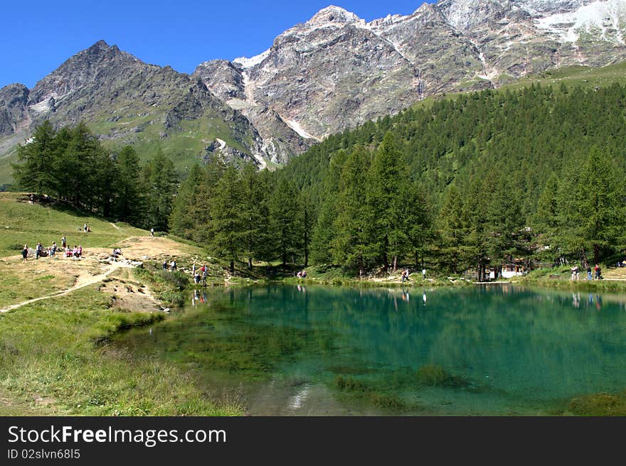 A view of green lake in the italian alps