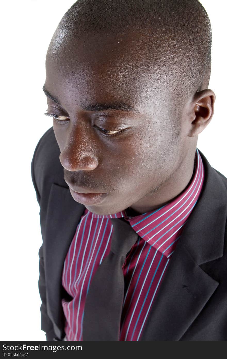 Young black businessman over white background. Isolated fresh teenager in suit.