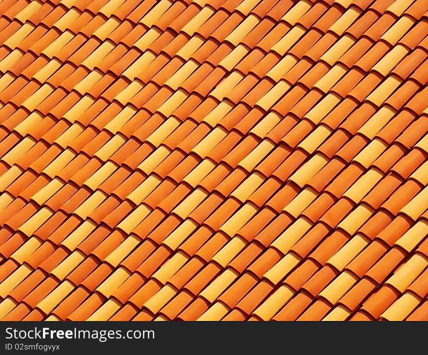 Rows of orange tiles on a roof.