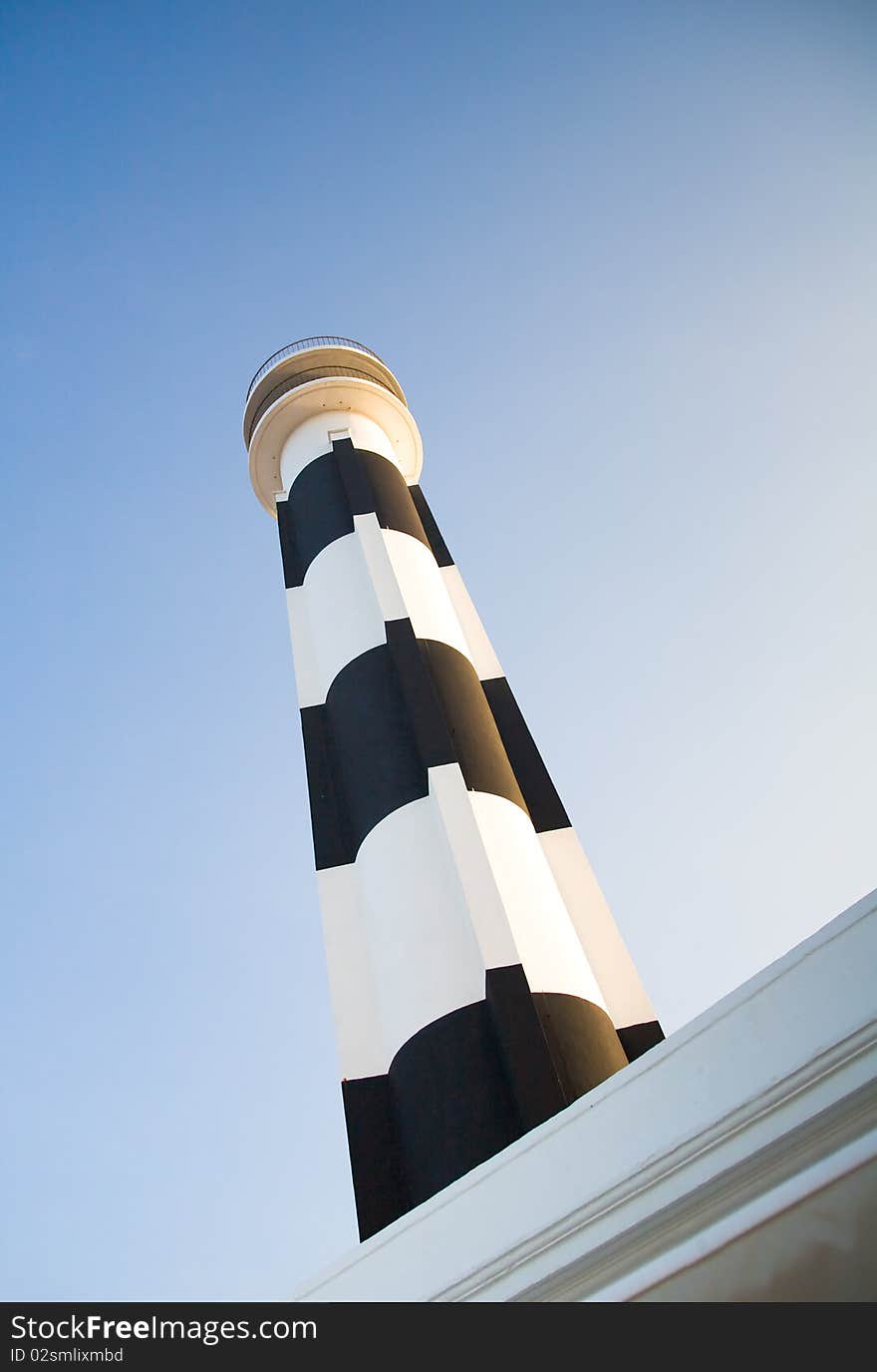 Lighthouse in the town of Calan Bosch on the Spanish island of Menorca. Lighthouse in the town of Calan Bosch on the Spanish island of Menorca