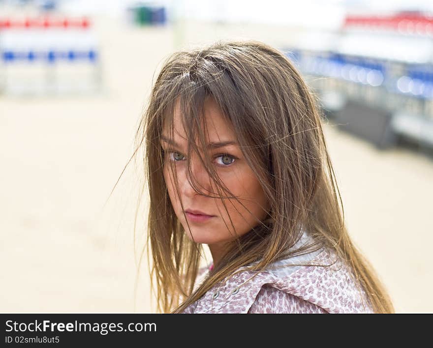 Cute attractive women at the beach. Summer portrait. Blurring background.