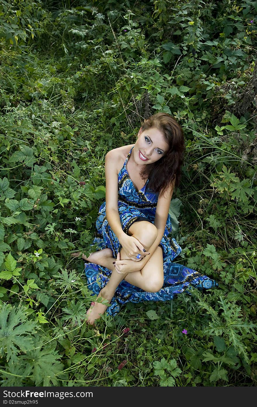 Outdoor portrait of young beautiful girl in summer brushwood. Outdoor portrait of young beautiful girl in summer brushwood.