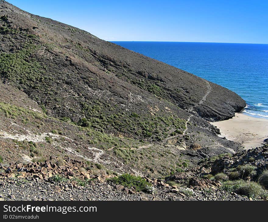 Old lava flow on beach, Andalusia, Spain