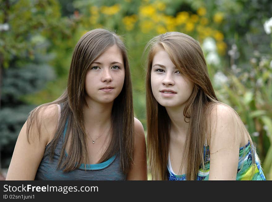 Two teenage girls spend some time outdoors. Two teenage girls spend some time outdoors.