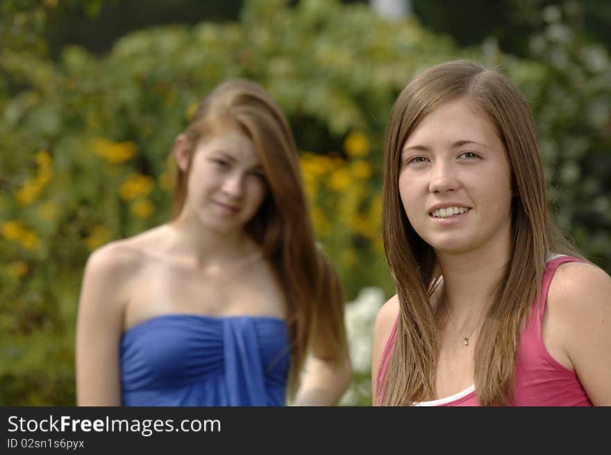 Two teenage girls spend some time outdoors. Two teenage girls spend some time outdoors.