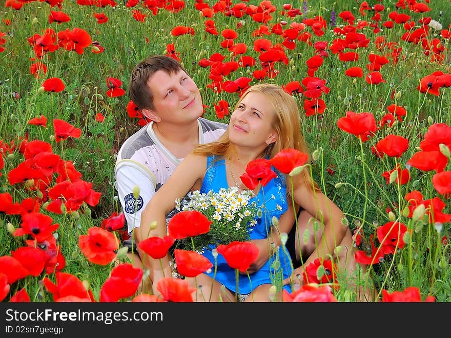 Loving couple in the meadow