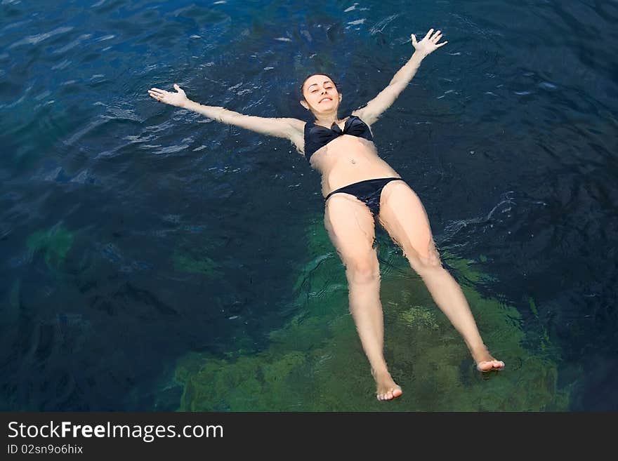 Young girl on the water