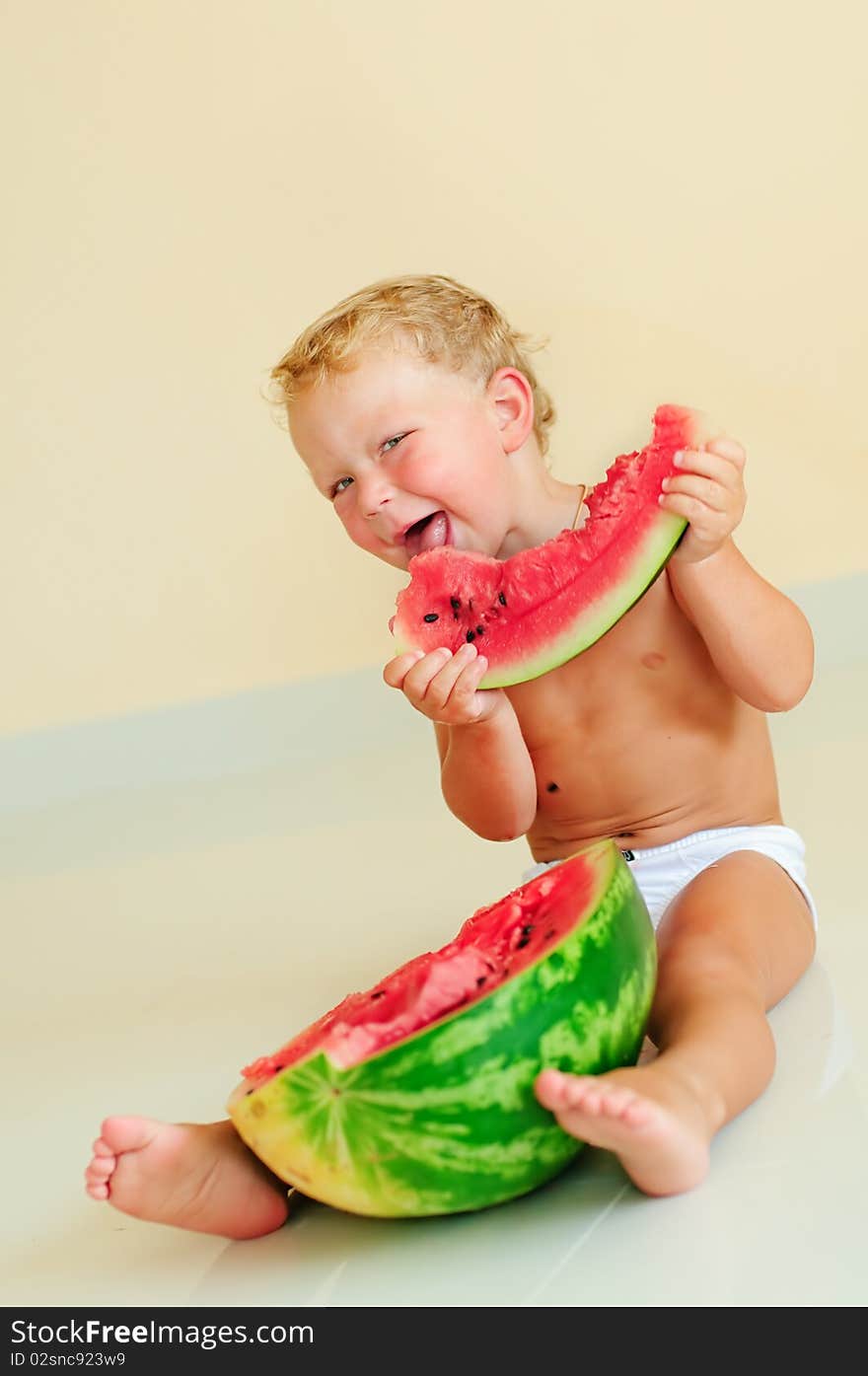 Funny boy eating with appetite ripe watermelon. Funny boy eating with appetite ripe watermelon