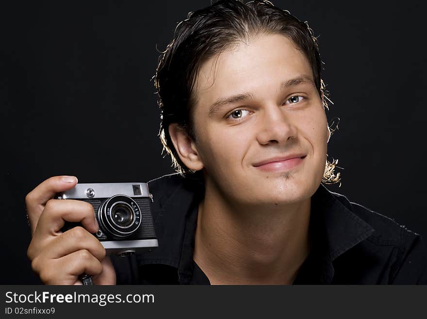 Man holding a photo camera. Man holding a photo camera