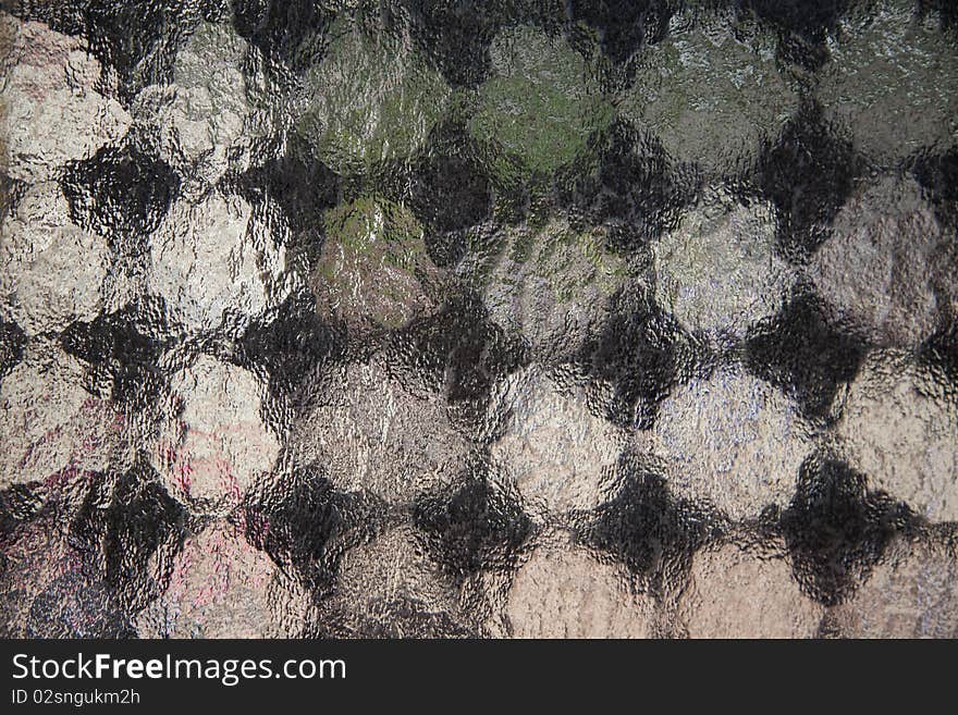 A background of frosted window with checkerboard pattern. A background of frosted window with checkerboard pattern