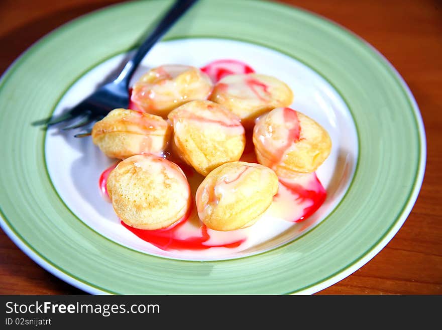 A traditional Dutch batter treat. Resembling small, fluffy pancakes, they are made with yeast and buckwheat flour. A traditional Dutch batter treat. Resembling small, fluffy pancakes, they are made with yeast and buckwheat flour