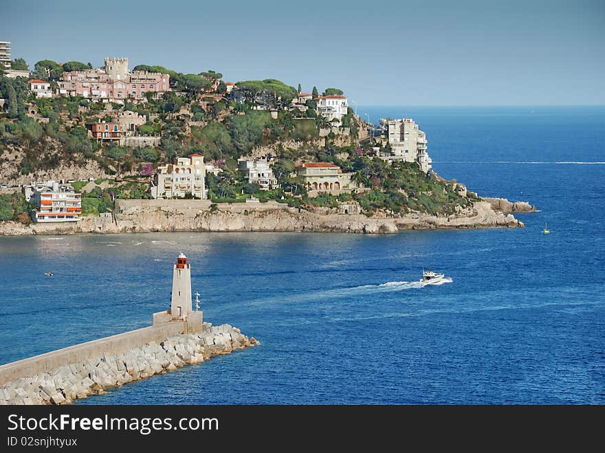 The harbour and beacon in port of Nice, France. The harbour and beacon in port of Nice, France.