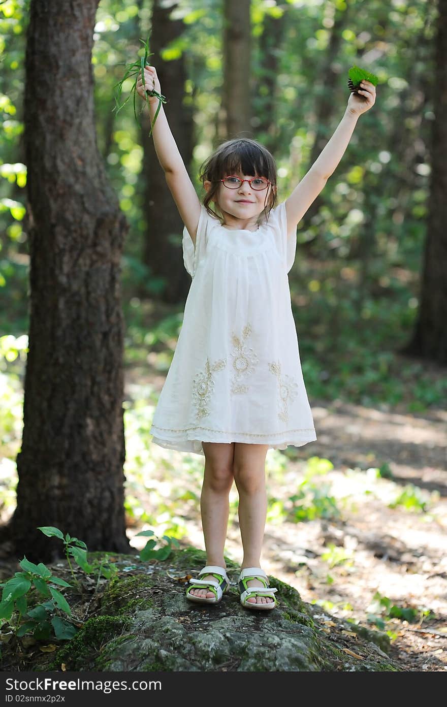 Nice toddler girl with hands up