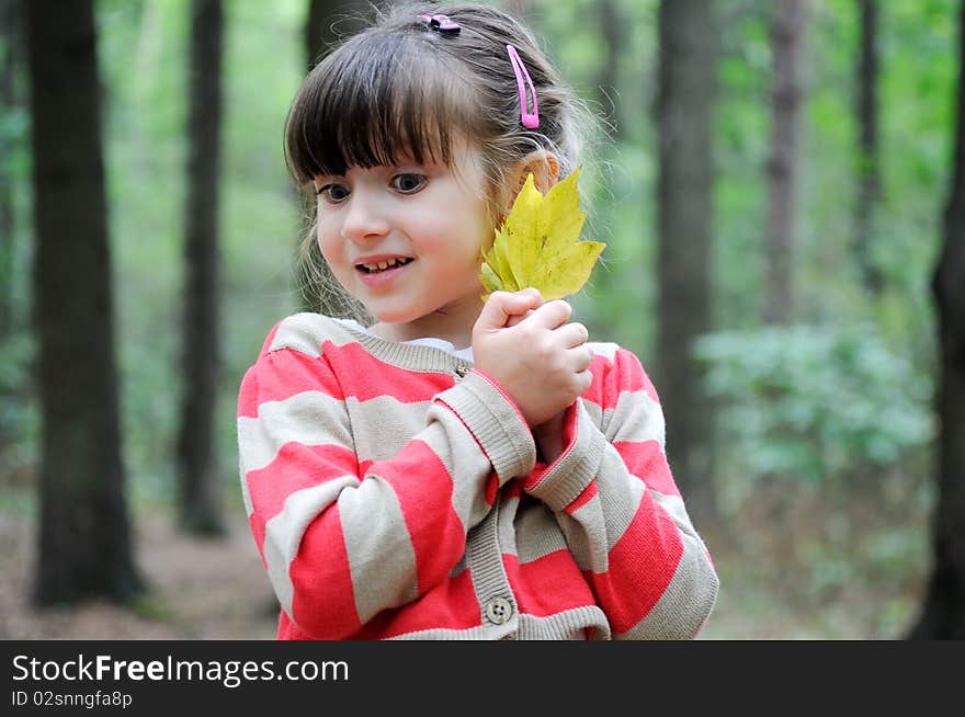 Nice Toddler Girl With Yellow Leave