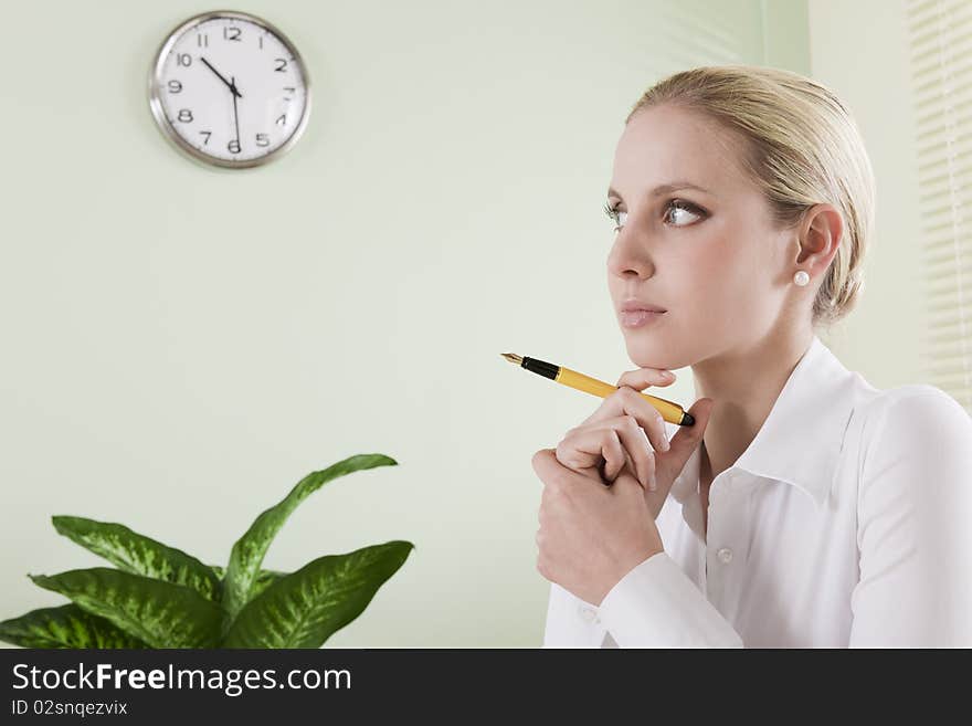 Pensive businesswoman in her office