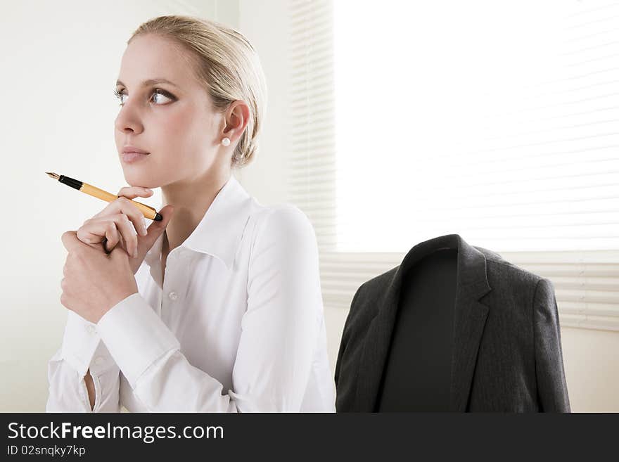 Pensive businesswoman in her office