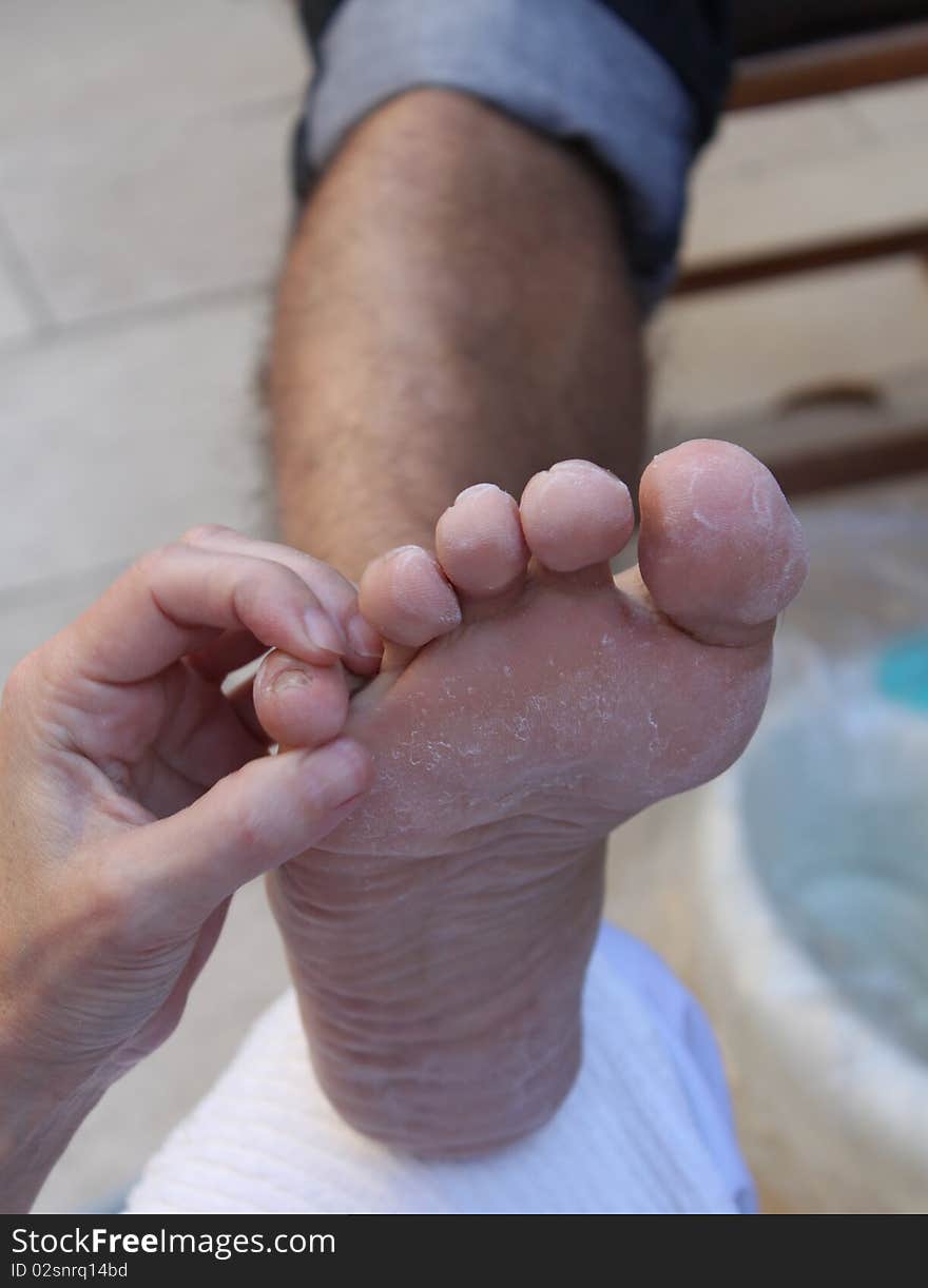 A male feet in pedicure. A male feet in pedicure