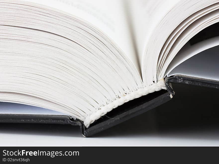 Binder of an opened book. Macro view.