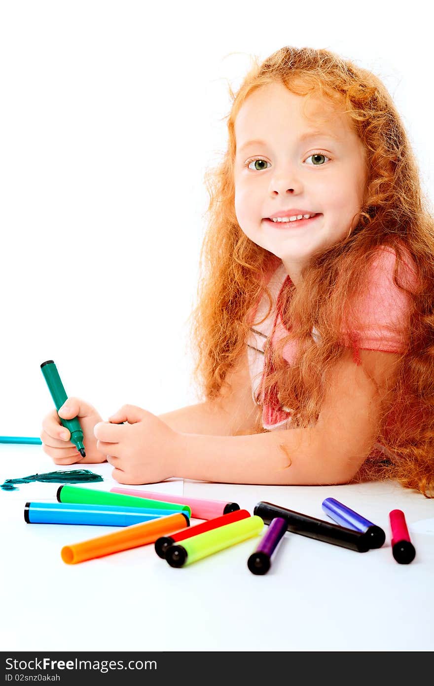 Portrait of a happy girl with felt pens. Isolated over white background. Portrait of a happy girl with felt pens. Isolated over white background.