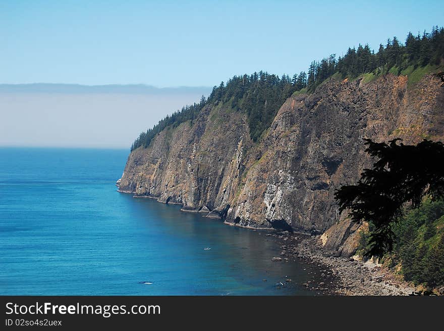 Cliffs on coast of oregon with fog rolling in. Cliffs on coast of oregon with fog rolling in