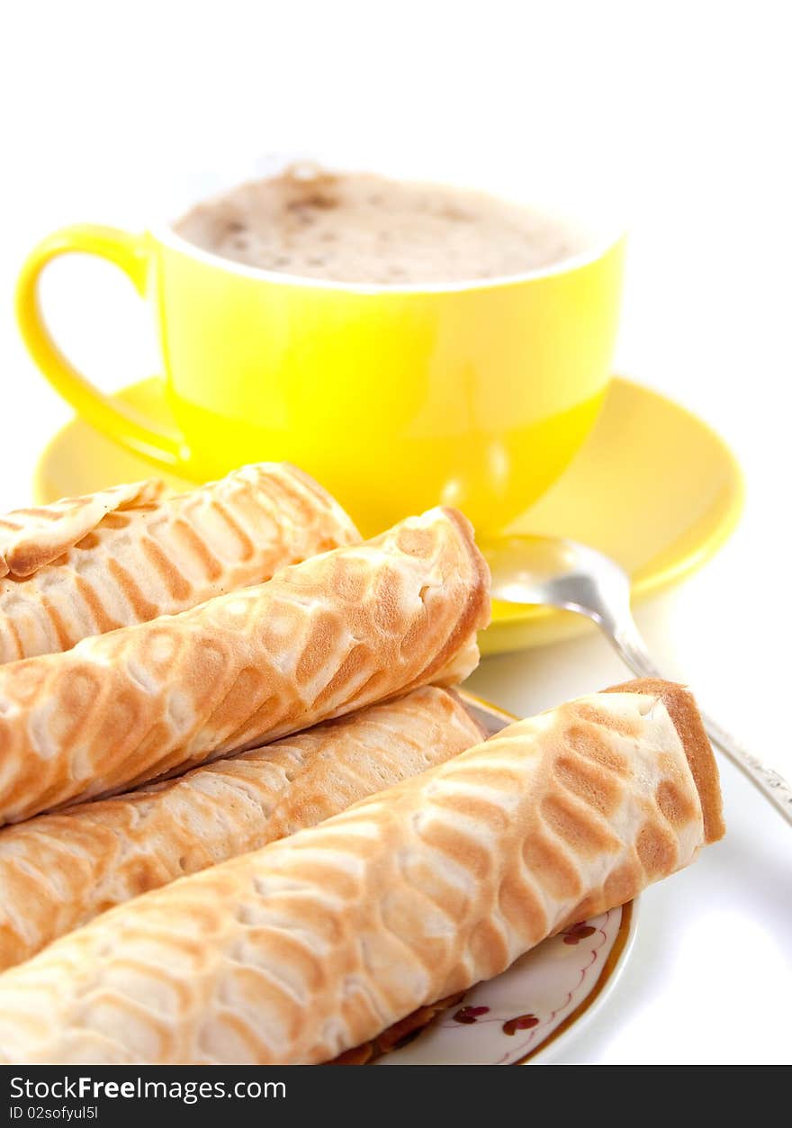 Breakfast with waffles and a cup of coffee. Isolated on white background. Breakfast with waffles and a cup of coffee. Isolated on white background