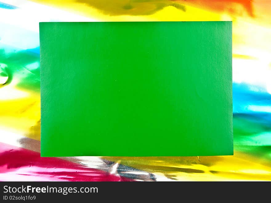 Green paper blank on colored background. Studio shot. Green paper blank on colored background. Studio shot