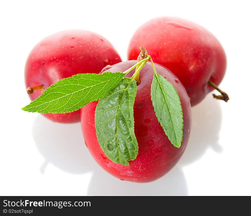 Three red ripe plums, isolated on white. Three red ripe plums, isolated on white