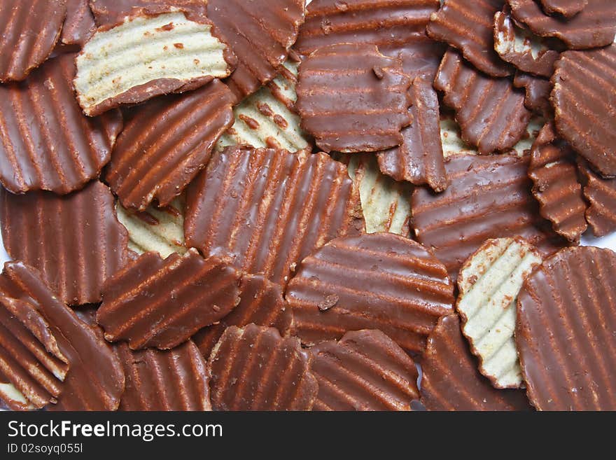 Pattern of Ridged potato chips cover with Chocolate using as background