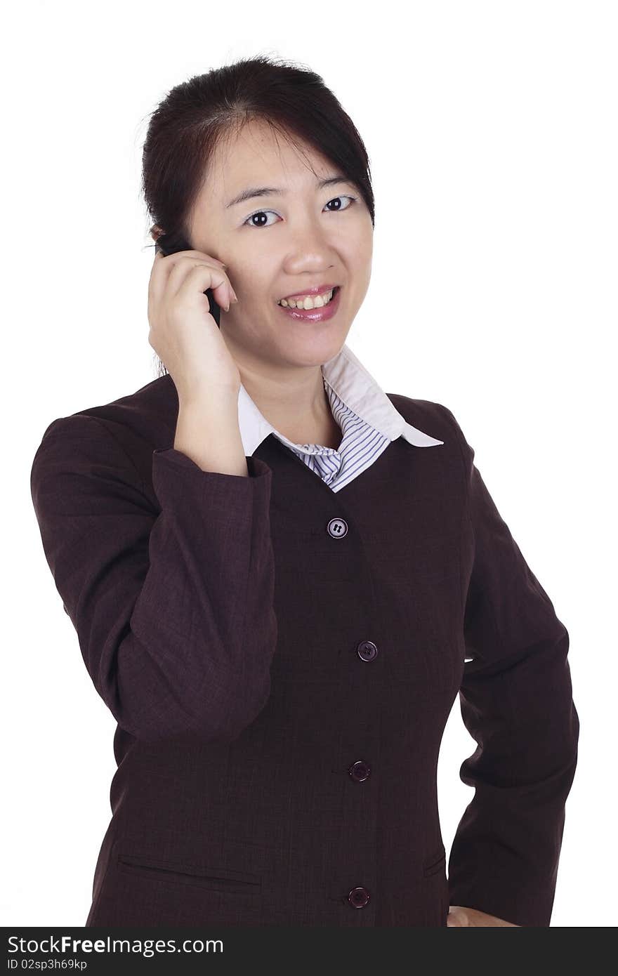 A businesswoman having a phone conversation. A businesswoman having a phone conversation