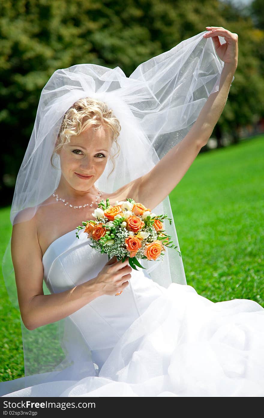 Young beautiful  bride with wedding bouquet. Young beautiful  bride with wedding bouquet